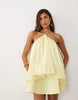halter neck trapeze mini dress in soft yellow