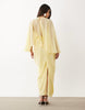 draped cape bodice maxi dress with skirt and open-back tassel detail in yellow