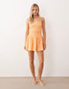 crinkle mini sundress with shirred dropped waist in orange spritz