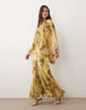 full volume cape sleeve maxi dress with godets in green floral print