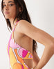 Kulani Kinis sunrise swirl halterneck mini dress in pink and orange