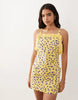 pinny mini dress with pockets and ruffles in yellow ditsy print