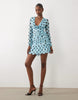 Kaiia Exclusive mesh overlay long sleeve cowl neck asymmetric hem mini dress in blue and black polka dot