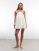 Noughts & Kisses linen blend beaded strap detailing halterneck lace up back mini dress in cream