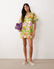 crew neck mini dress with tie sleeve detail in green and pink floral print