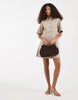 Vero Moda button front fit and flare denim mini dress in beige wash