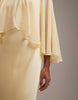 Bridesmaids sheer chiffon cape overlay bias cut satin dress in lemon