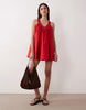 v-neck poplin mini smock sundress with lace overlay in tomato red