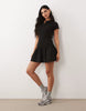 hybrid rib interlock peplum hem mini polo dress in black