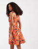 Vero Moda sleeveless pleated front mini dress in orange sea shell print