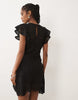 crochet flutter sleeve mini dress in black scuba-style fabric