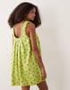 ruched neck mini sundress in green floral print performance fabric
