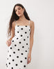 cami midi dress with side slit in buttermilk and black polka dots