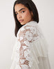 Noughts & Kisses crochet lace high neck ruffle trim mini dress in white