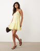 halterneck mini dress with lace trim details in soft yellow