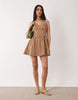 waisted V-neck mini sundress with seaming details in brown and pink check