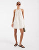 halter neck trapeze shaped waist mini dress in cream