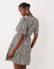 VILA tie waist polka dot mini dress in cream and black