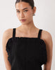 pinny mini dress with pockets and ruffles in black