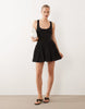 dropped waist mini dress with crinkle cotton skirt in black