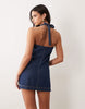 Good American halter neck mini denim dress in dark blue wash