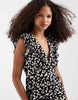 Vero Moda Easy Joy ruffle shoulder plunge front midi dress in black ditsy daisy print