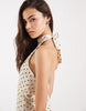 Vero Moda Tall halter neck polka dot mini dress in cream and black
