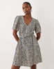 VILA tie waist polka dot mini dress in cream and black