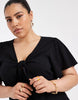 Vero Moda Curve Easy Joy short sleeve bow front mini dress in black