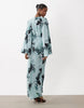 long sleeve tucked waist bias maxi dress in blue blurred floral print