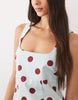 square neck bodycon mini sundress in blue and burgundy polka dots