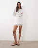 Mango Teen knit long sleeve mini dress in white