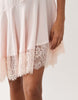 lace trim mini slip dress with asymmetric hem in pale pink