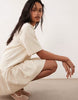 drop waist mini dress in beige