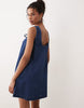 denim scoop neck and back mini dress with bow front in dark mid blue
