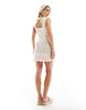 Esmee Exclusive mini lace beach dress with ruffle skirt in cream