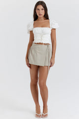stone pleated wrap mini skirt