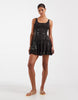 scoop neck mini dress with sheer lace panels and floral embellishment in washed charcoal