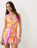 Kulani Kinis sunrise swirl halterneck mini dress in pink and orange