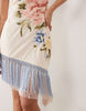 embroidered mini dress with fringe hem in pale pink