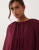 full volume cape maxi dress with godets in berry