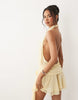 Oh Polly chiffon halter neck rosette detail draped waist mini dress in butter yellow