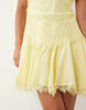 halterneck mini dress with lace trim details in soft yellow
