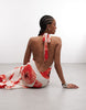 Susmie's halterneck maxi dress with poppy print in white and red