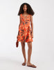 Vero Moda sleeveless pleated front mini dress in orange sea shell print