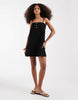 denim cami mini dress with button detailing in clean black