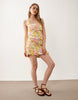 ruched center seam mini dress in floral print