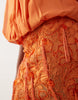pleated halter neck draped embellished mini dress in orange