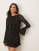 flocked floral mini dress with flute sleeve in black