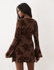 flocked floral mini dress with fluted sleeves in ginger